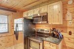 Eagle`s Lair kitchen with beautiful wood cabinets. 